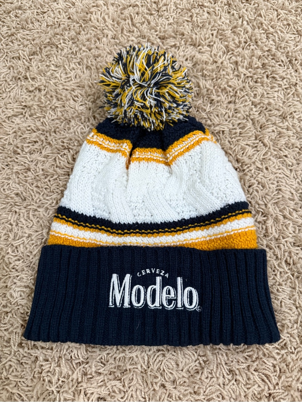 ModelCo Knit Pom Beanie in Navy, White & Gold